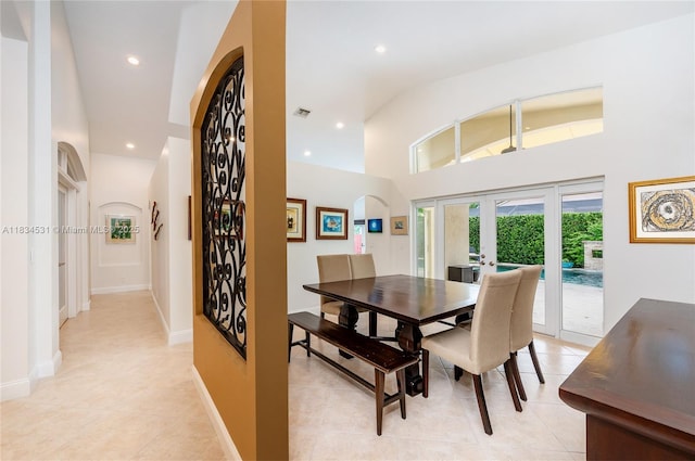1583 SW 191st Ave, Pembroke Pines, FL 33029 - dining space featuring light tile patterned flooring, recessed lighting, arched walkways, french doors, and a high ceiling
