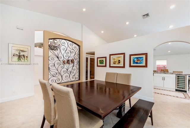 1583 SW 191st Ave, Pembroke Pines, FL 33029 - dining room with wine cooler, arched walkways, recessed lighting, and vaulted ceiling