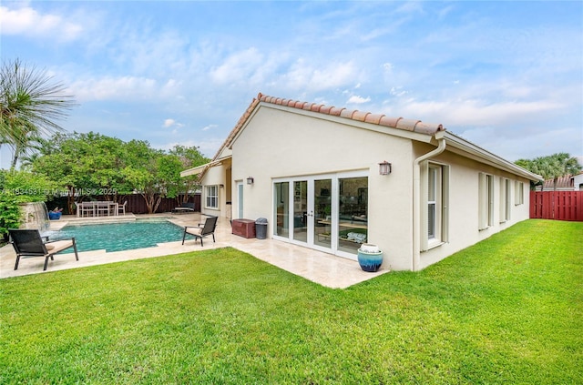 1583 SW 191st Ave, Pembroke Pines, FL 33029 - rear view of property with a fenced backyard, stucco siding, a patio area, and a tiled roof