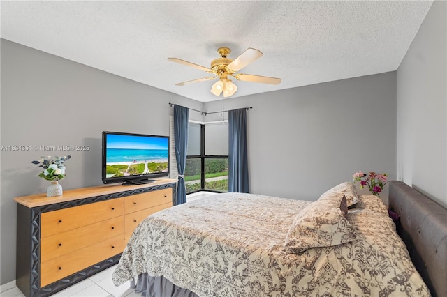 8577 W Boca Glades Blvd Unit D, Boca Raton, FL 33434 - bedroom with a textured ceiling, ceiling fan, and tile patterned flooring