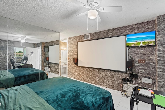 8577 W Boca Glades Blvd Unit D, Boca Raton, FL 33434 - tiled bedroom featuring a textured ceiling and a ceiling fan