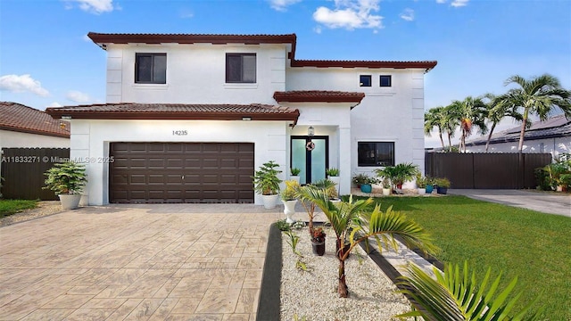 14235 SW 294th St, Homestead, FL 33033 - mediterranean / spanish house featuring an attached garage, stucco siding, decorative driveway, and a tile roof