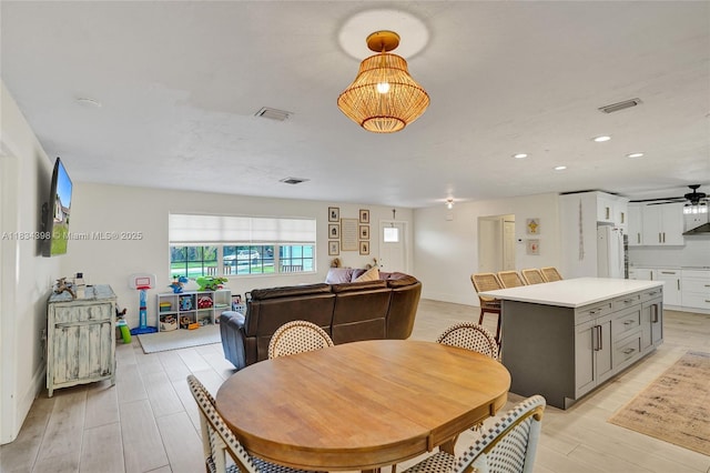 7735 Edgewater Dr, Lake Clarke Shores, FL 33406 - dining space featuring light wood finished floors, a ceiling fan, and recessed lighting