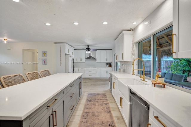 7735 Edgewater Dr, Lake Clarke Shores, FL 33406 - kitchen featuring dishwasher, a ceiling fan, light countertops, white cabinetry, and recessed lighting