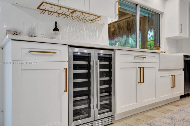 7735 Edgewater Dr, Lake Clarke Shores, FL 33406 - indoor dry bar featuring beverage cooler, light wood finished floors, and dishwasher