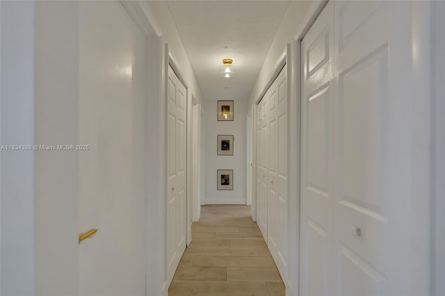 7735 Edgewater Dr, Lake Clarke Shores, FL 33406 - hall featuring light wood-style flooring and baseboards