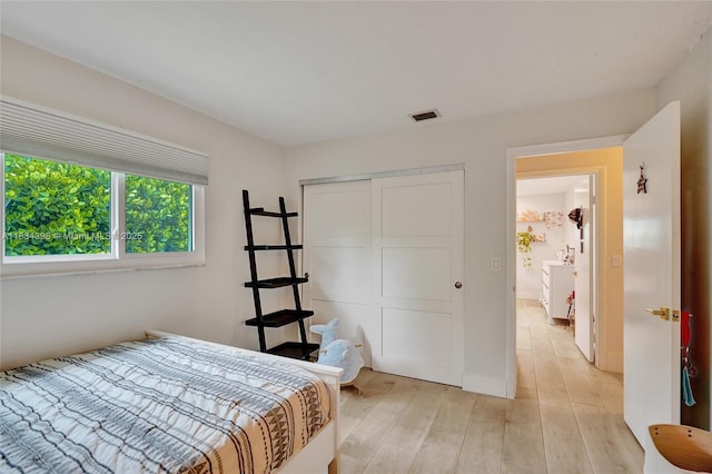 7735 Edgewater Dr, Lake Clarke Shores, FL 33406 - bedroom with a closet and light wood finished floors