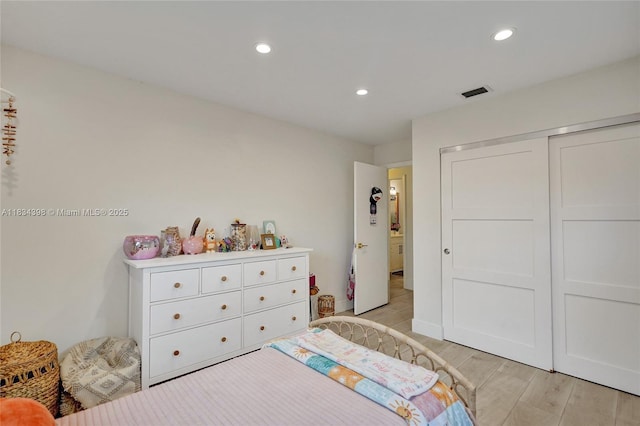7735 Edgewater Dr, Lake Clarke Shores, FL 33406 - bedroom featuring recessed lighting, light wood-style floors, and a closet