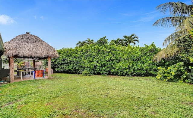 7735 Edgewater Dr, Lake Clarke Shores, FL 33406 - view of green lawn featuring a gazebo and a patio area