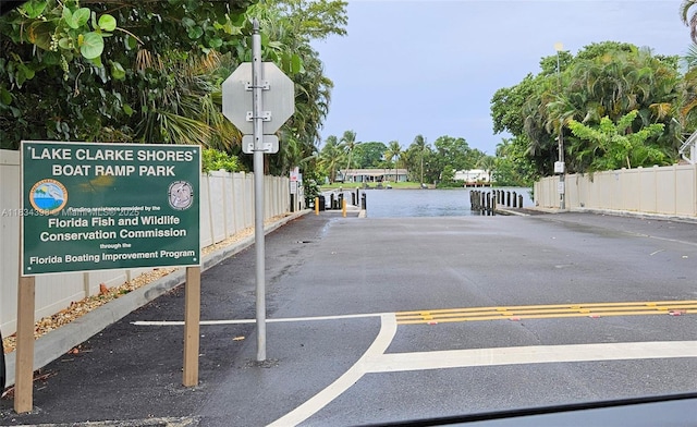 7735 Edgewater Dr, Lake Clarke Shores, FL 33406 - view of parking / parking lot with a water view