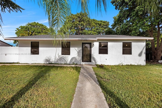 324 SW 16th Ter, Homestead, FL 33030 - view of front of home featuring a front lawn and stucco siding