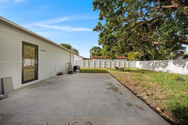 324 SW 16th Ter, Homestead, FL 33030 - fenced backyard with a patio