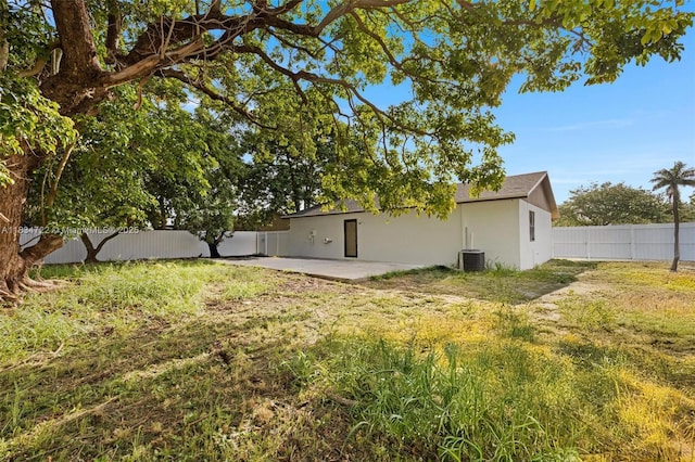 324 SW 16th Ter, Homestead, FL 33030 - back of property featuring a patio, a fenced backyard, and stucco siding