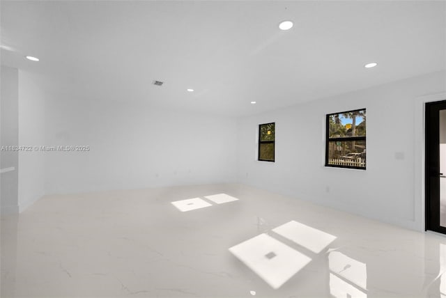 324 SW 16th Ter, Homestead, FL 33030 - empty room with recessed lighting and marble finish floors