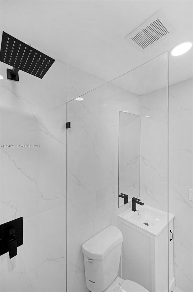 324 SW 16th Ter, Homestead, FL 33030 - full bath with a marble finish shower, tile walls, and vanity