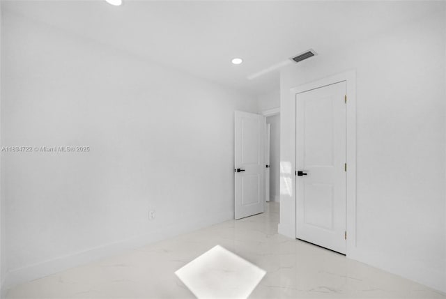 324 SW 16th Ter, Homestead, FL 33030 - unfurnished room featuring light marble finish flooring and recessed lighting