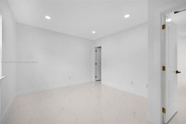 324 SW 16th Ter, Homestead, FL 33030 - unfurnished room with marble look tiles and recessed lighting