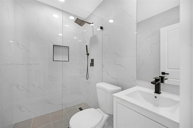 324 SW 16th Ter, Homestead, FL 33030 - bathroom with vanity, a marble finish shower, and tile walls