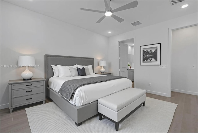 324 SW 16th Ter, Homestead, FL 33030 - bedroom featuring wood finished floors, recessed lighting, ceiling fan, and ensuite bath