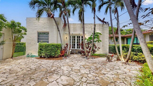 1111 Columbus Blvd, Coral Gables, FL 33134 - rear view of property featuring stucco siding, french doors, and a patio area
