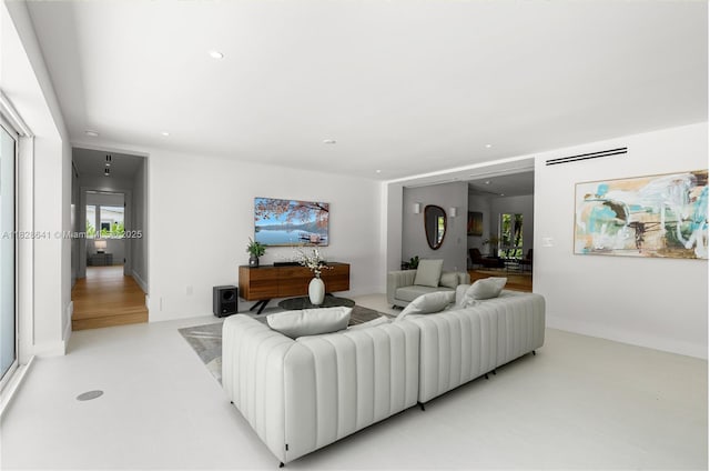 45 NE 104th St, Miami Shores, FL 33138 - living room featuring recessed lighting and baseboards