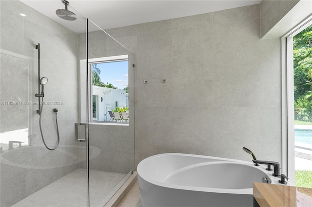 45 NE 104th St, Miami Shores, FL 33138 - bathroom with a freestanding tub and a tile shower