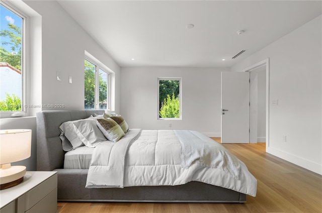 45 NE 104th St, Miami Shores, FL 33138 - bedroom featuring light wood-type flooring and baseboards