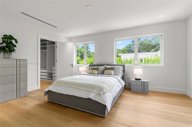45 NE 104th St, Miami Shores, FL 33138 - bedroom featuring light wood finished floors, a walk in closet, and recessed lighting