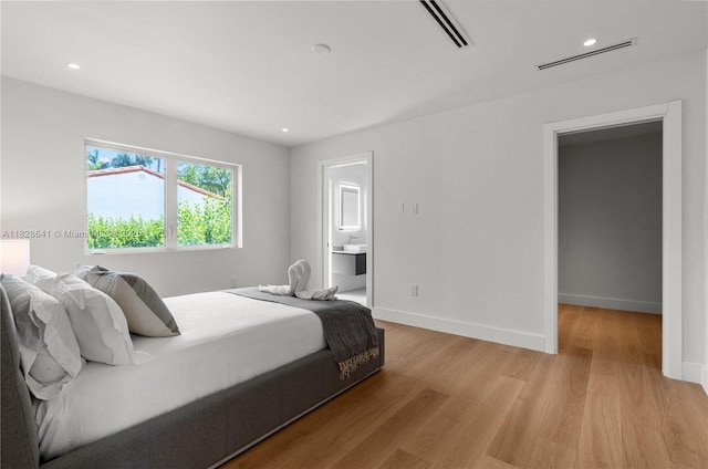 45 NE 104th St, Miami Shores, FL 33138 - bedroom featuring light wood-style flooring, recessed lighting, and ensuite bathroom