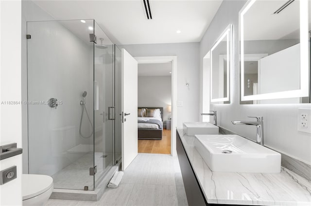 45 NE 104th St, Miami Shores, FL 33138 - ensuite bathroom with a stall shower, double vanity, and recessed lighting