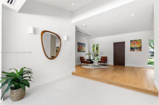 45 NE 104th St, Miami Shores, FL 33138 - foyer entrance featuring plenty of natural light, wood finished floors, and recessed lighting