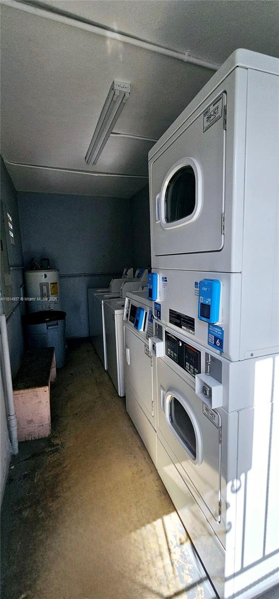 3494 E 4th Ave Unit 1207, Hialeah, FL 33013 - communal laundry room with stacked washing machine and dryer