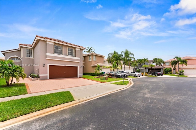1894 SW 149th Ave, Miramar, FL 33027 - mediterranean / spanish-style home featuring stucco siding, an attached garage, a tile roof, a residential view, and driveway