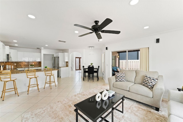 1894 SW 149th Ave, Miramar, FL 33027 - living room featuring arched walkways, recessed lighting, light tile patterned floors, and a ceiling fan