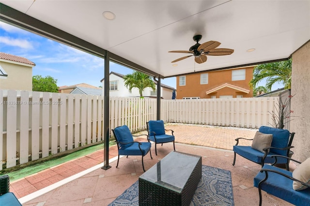 1894 SW 149th Ave, Miramar, FL 33027 - fenced backyard with a patio, a ceiling fan, and an outdoor hangout area