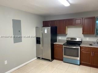 1770 NW 44th St, Miami, FL 33142 - kitchen with appliances with stainless steel finishes, light countertops, and light tile patterned floors