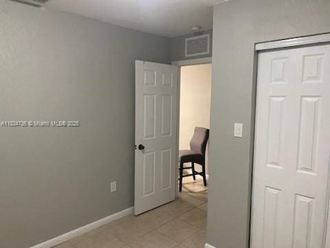 1770 NW 44th St, Miami, FL 33142 - bedroom with baseboards and light tile patterned floors