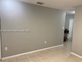 1770 NW 44th St, Miami, FL 33142 - unfurnished room with baseboards and light tile patterned floors