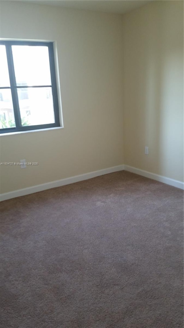 22441 SW 88th Pl Unit 204-5, Cutler Bay, FL 33190 - carpeted empty room with baseboards