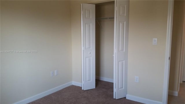 22441 SW 88th Pl Unit 204-5, Cutler Bay, FL 33190 - unfurnished bedroom featuring dark colored carpet and a closet