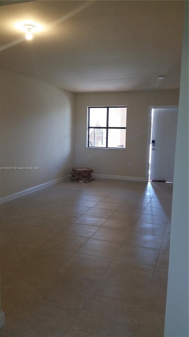22441 SW 88th Pl Unit 204-5, Cutler Bay, FL 33190 - tiled spare room with baseboards