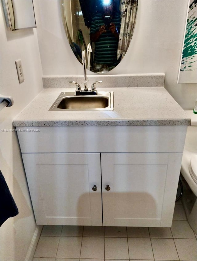 bathroom with vanity and tile patterned floors