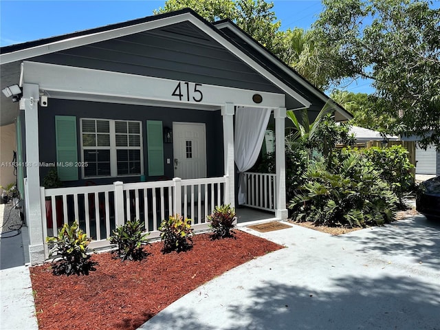 doorway to property with covered porch