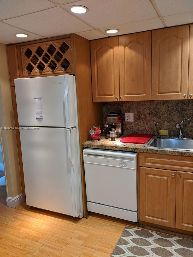 900 Saint Charles Pl Unit L6, Pembroke Pines, FL 33026 - kitchen with white appliances, light wood finished floors, decorative backsplash, and brown cabinetry