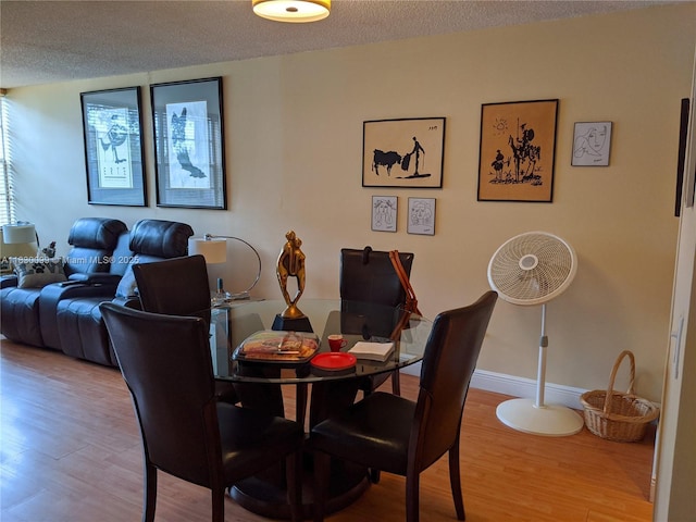 900 Saint Charles Pl Unit L6, Pembroke Pines, FL 33026 - dining room with wood finished floors and a textured ceiling