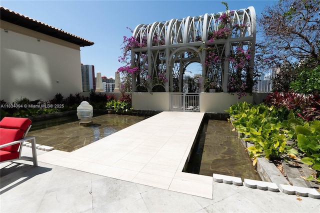 150 Sunny Isles Blvd Unit 1-Th403, Sunny Isles Beach, FL 33160 - view of patio / terrace with a gate