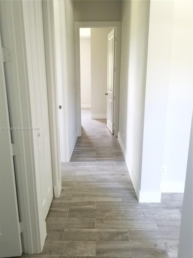 17186 N 84th Ct, Loxahatchee, FL 33470 - corridor with wood finished floors and baseboards