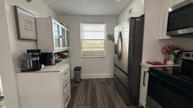 3910 Inverrary Blvd Unit 503-B, Lauderhill, FL 33319 - kitchen featuring stainless steel appliances, dark wood-style floors, white cabinets, and light countertops