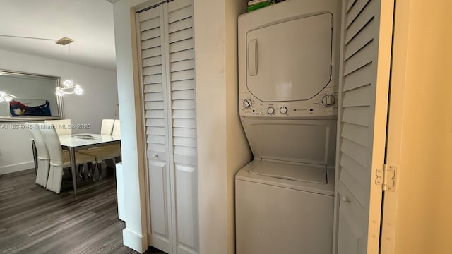 3910 Inverrary Blvd Unit 503-B, Lauderhill, FL 33319 - washroom featuring stacked washer / dryer and wood finished floors