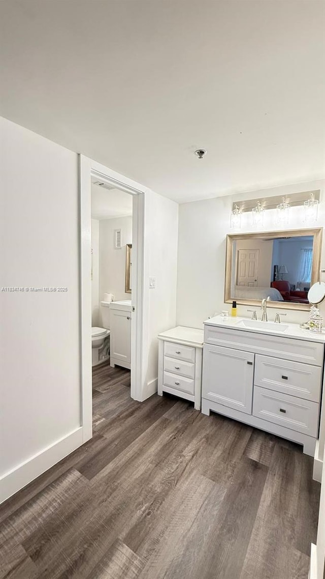 3910 Inverrary Blvd Unit 503-B, Lauderhill, FL 33319 - full bathroom featuring wood finished floors and vanity